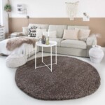 Hoogpolig vloerkleed taupe rond voorkant 2