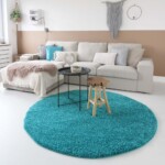 Hoogpolig vloerkleed turquoise rond voorkant